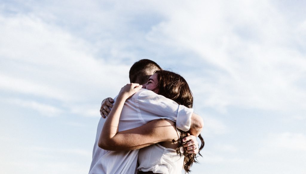 couple embraced in a hug with white skin