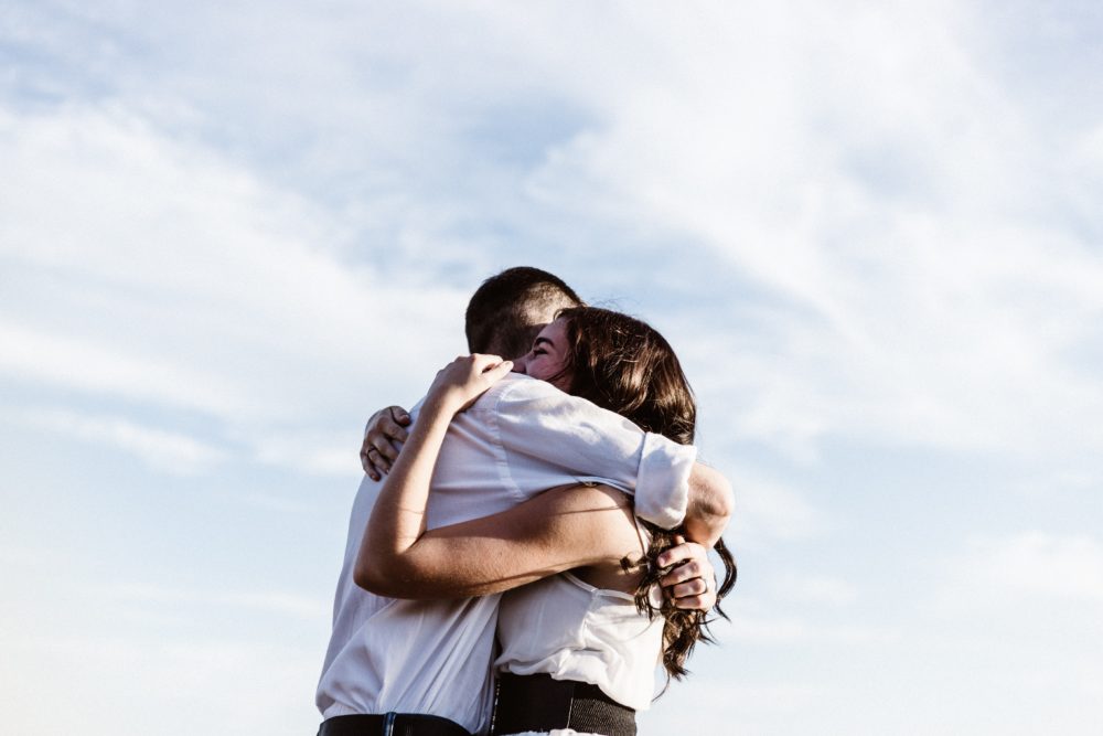 couple embraced in a hug with white skin